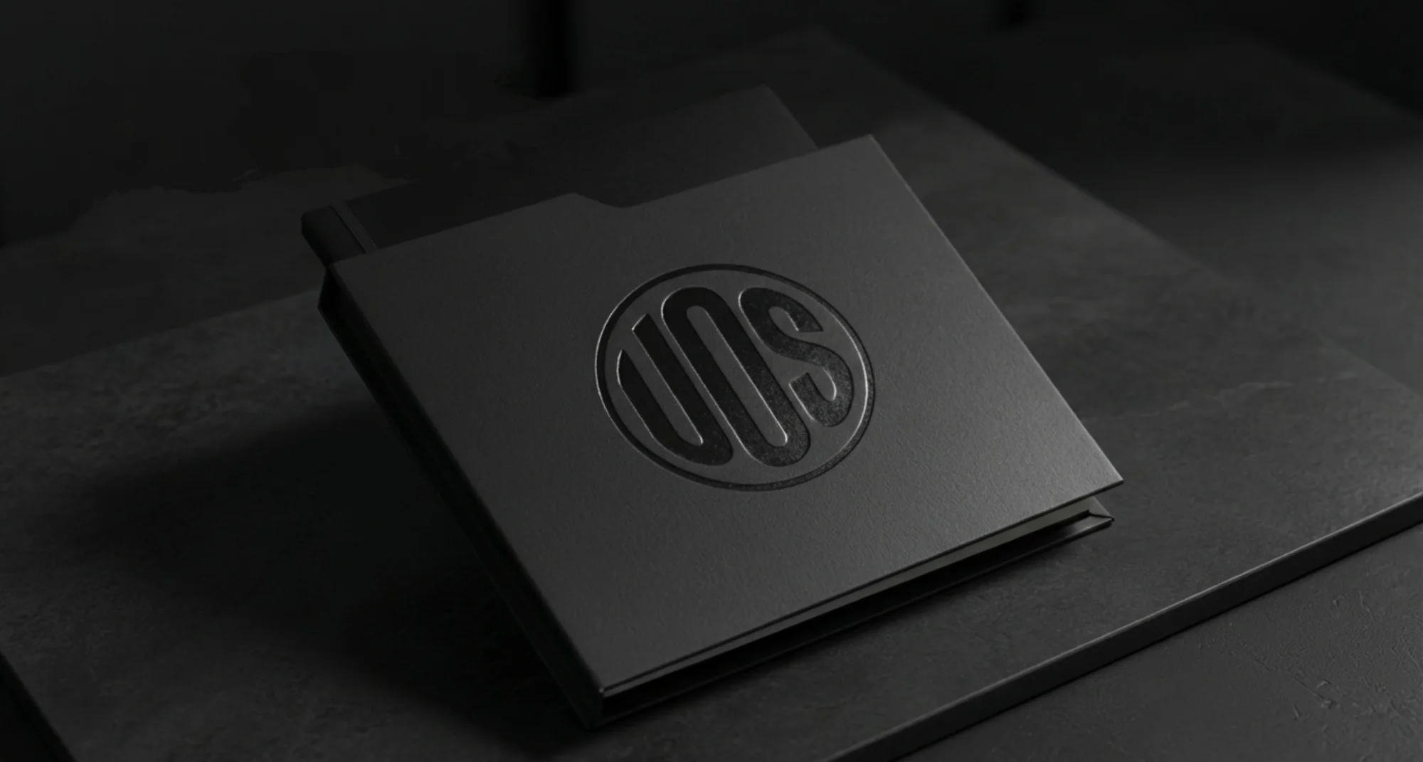 Black notebook with UOS embossed